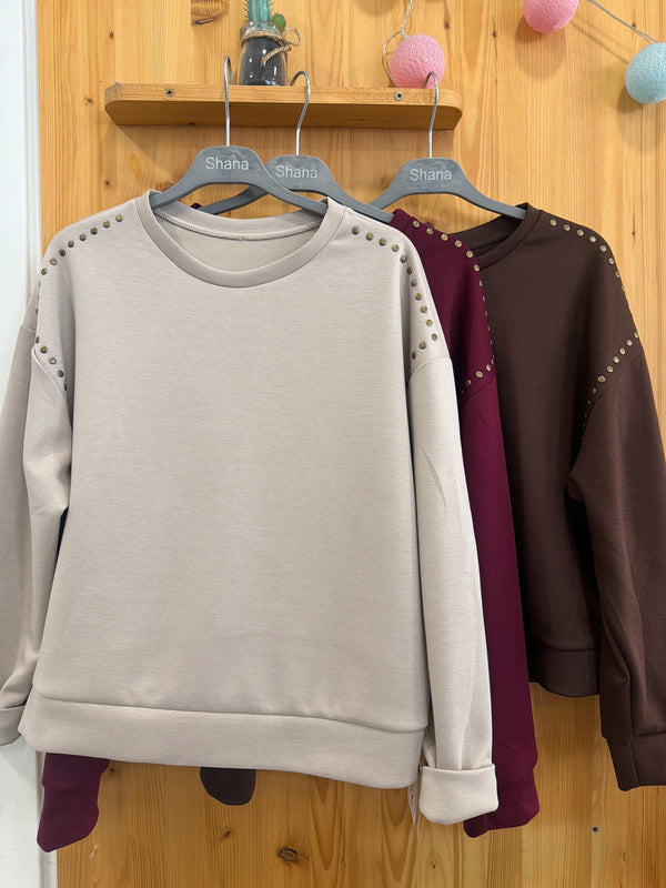 Sudadera tacto tachas